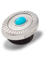 Jibbitz-S-Emblema-Turquesa-Plateado-Crocs